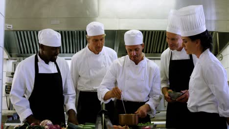 team of chef tasting food in the commercial kitchen 4k