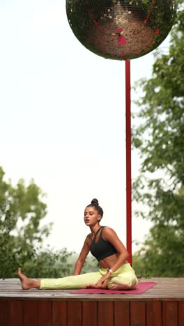 woman practicing yoga outdoors