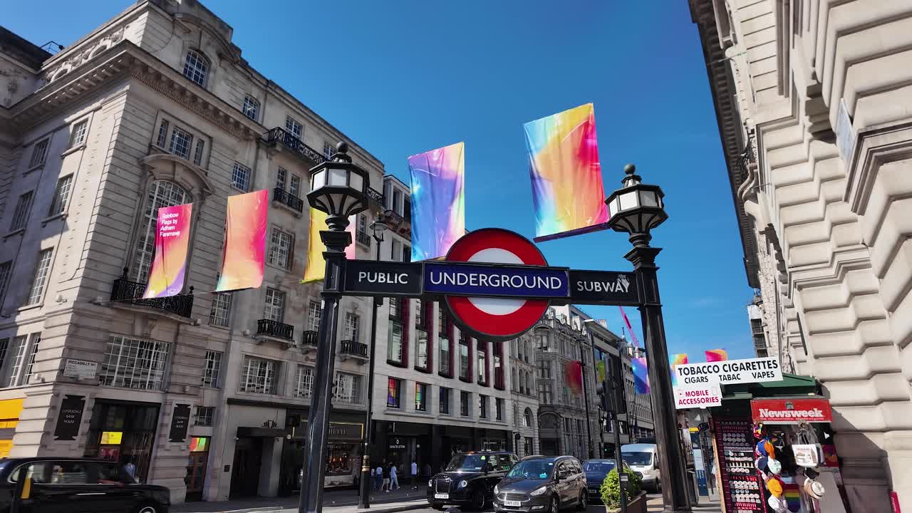 London Underground Sign on a Street with Colorful Flags