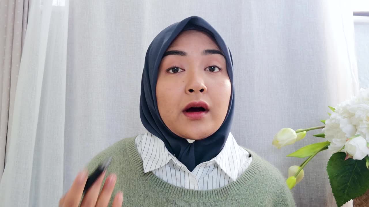 Young University Lecturer Answering Question During Video Lesson