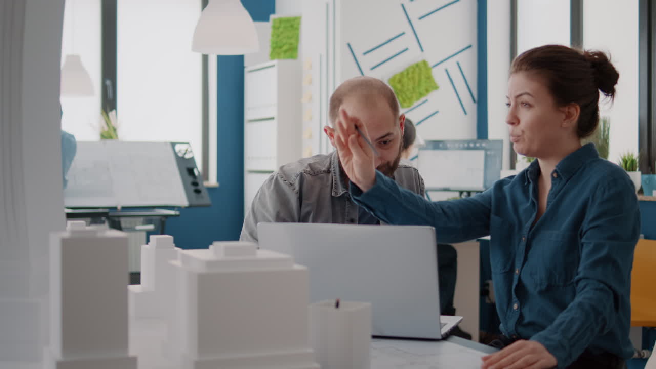 People working on an architectural model