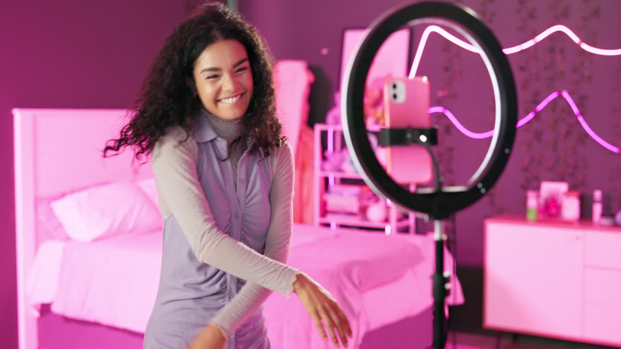 Woman vlogging in bedroom