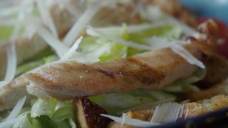 close-up of caesar salad with grilled chicken