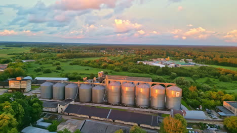 Aerial-modern-inland-granary,-grain-drying-complex,-commercial-seed-silos