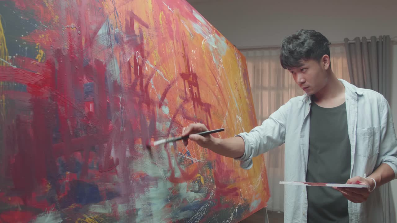 Artist Painting an Abstract Piece in a Home Studio