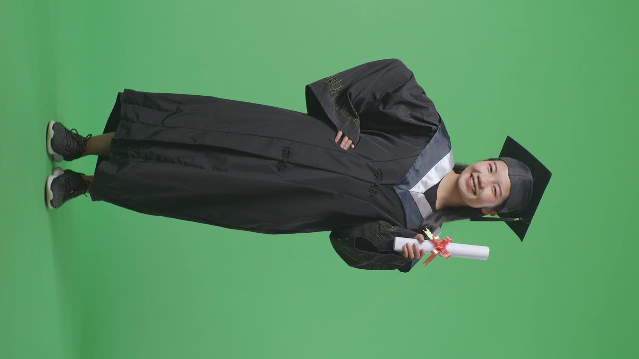 Woman in Graduation Gown with Diploma