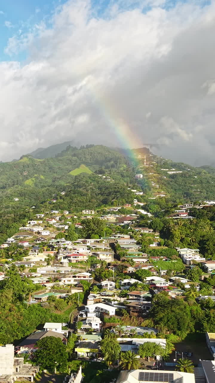 Real Rainbow Above Tahiti Island and Papeete City, French Polynesia. Vertical Drone Shot