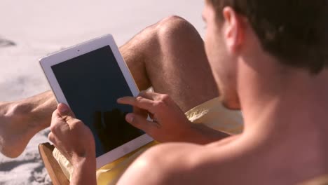 Man-using-his-tablet