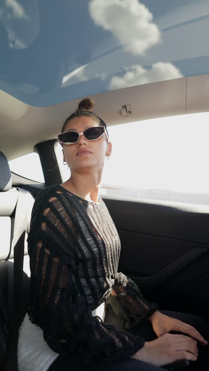 Woman in a car taking a selfie