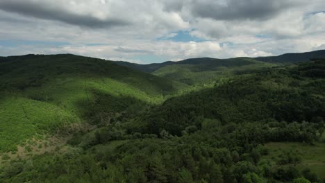 aerial woodland, view of cloudy and mountainous areas from the height, nature landscape drone view, the world is our source of life