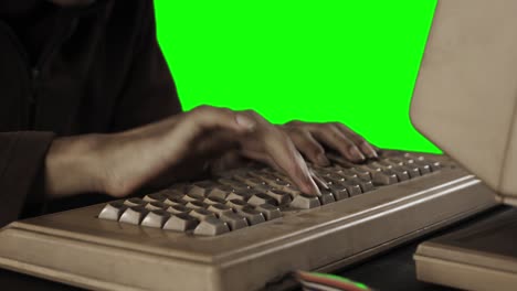 unknown man hands typing on an aged keyboard