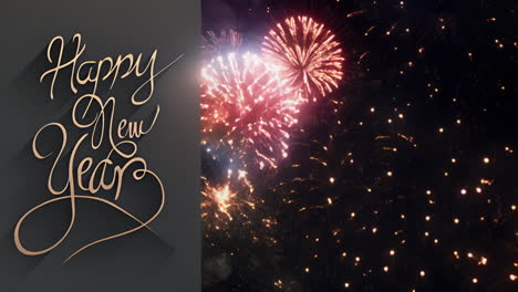 cinemagraph of happy new year text on grey over pink and golden fireworks exploding in night sky