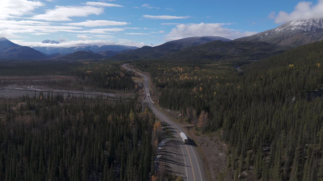 Scenic journey on the Alaska Highway in Yukon, surrounded by forests