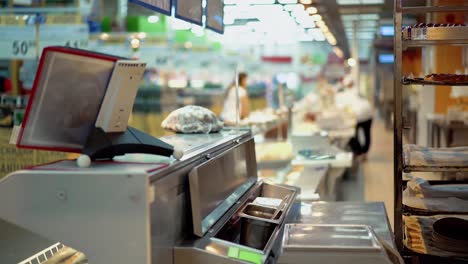 employees of the store are behind the counter