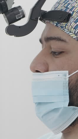 surgeon wearing headset and mask in operating room