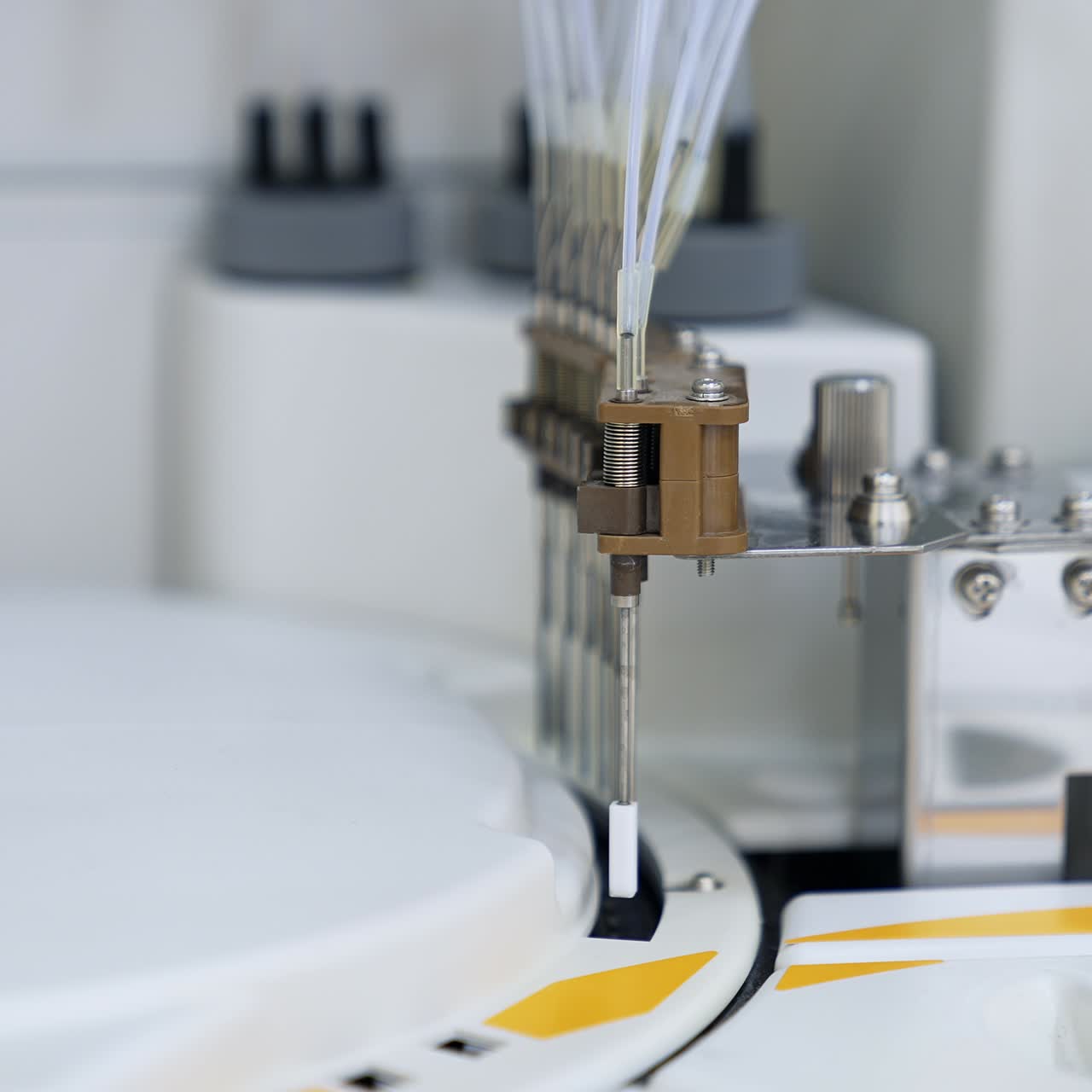 Apparatus detail moving up and down performing test. Technological advanced equipment in the modern blood test laboratory