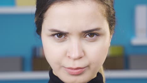 Close-up-of-cute-young-woman-getting-angry.