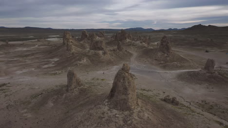 drone descending over an otherworldly landscape, the trona pinnacles in california