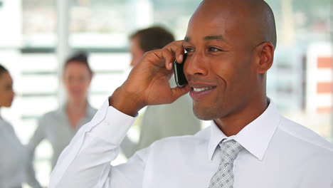 Man-in-a-suit-talking-on-the-phone