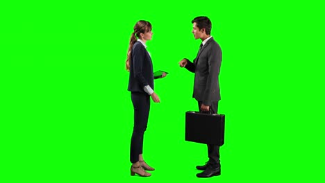 Side-view-of-business-people-making-a-deal-and-shaking-their-hands-with-green-screen