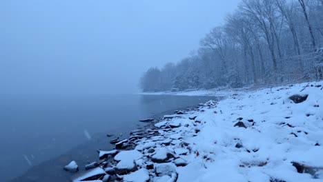 beautiful snowfall timelapse on a pristine mountain lake