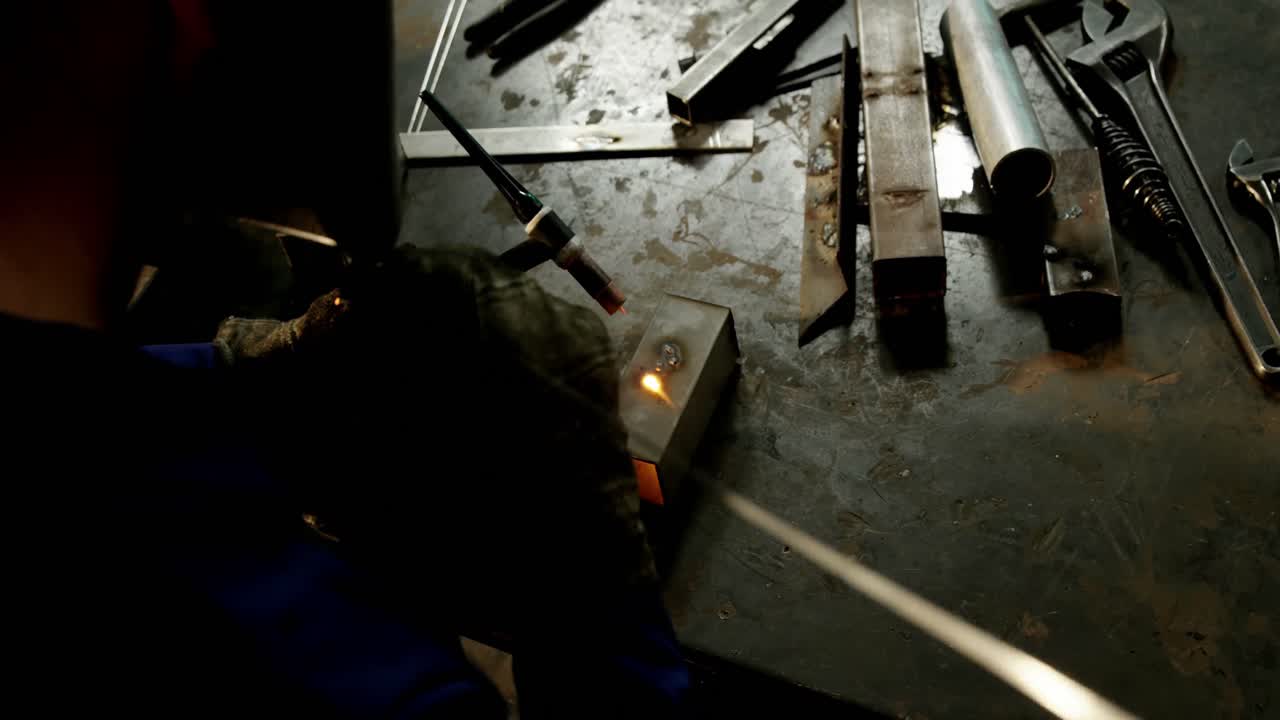 Male welder working on a piece of metal