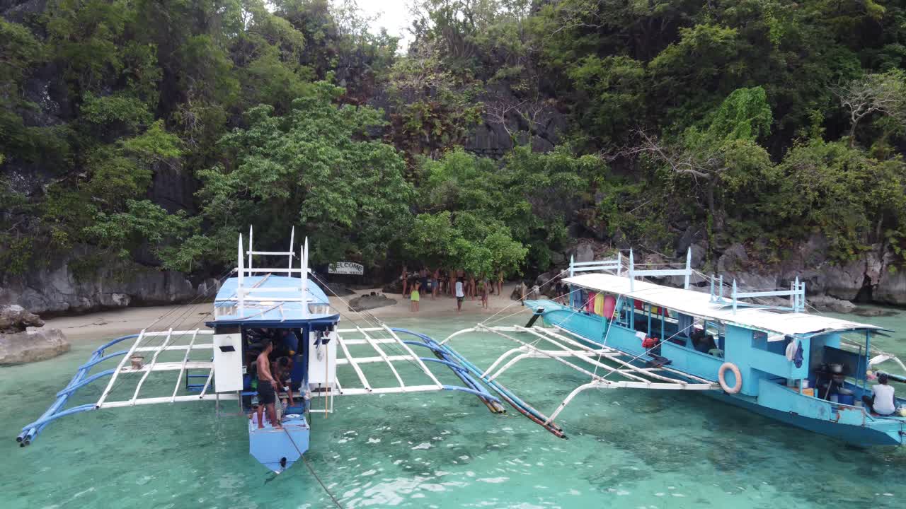 Tropical Beach Scene with Boats and People