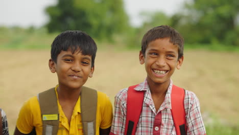 portraits of smiling indian schoolboys