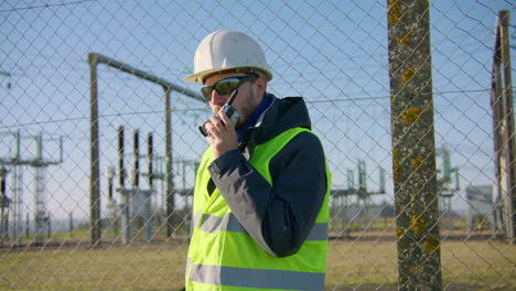 employee following safety precautions and transmitting message to team