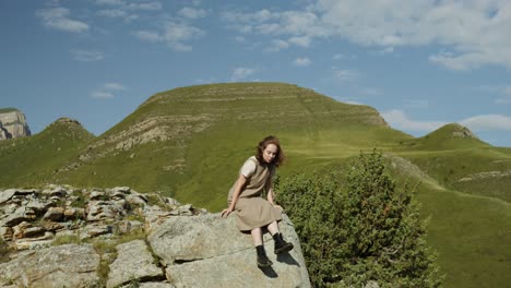 woman sitting on a mountaintop