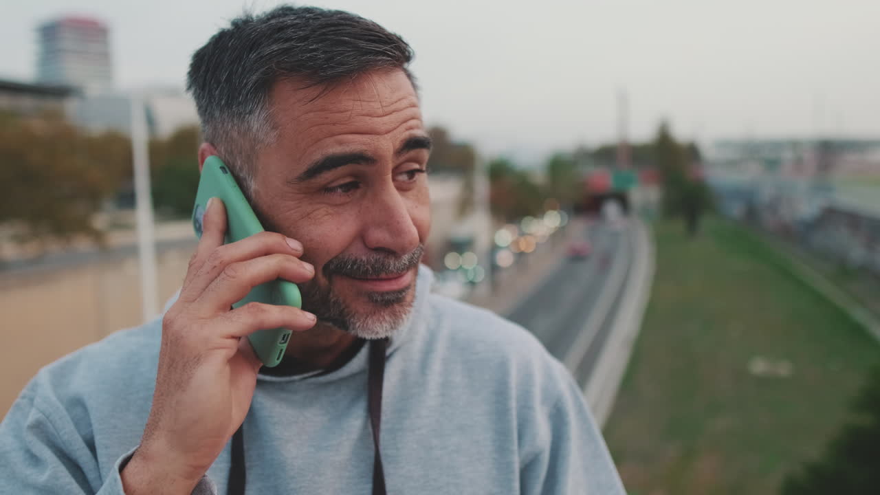 Man talking on the phone in the city