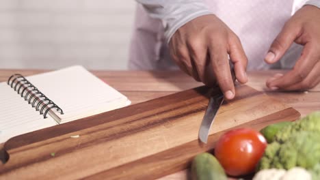 preparing a meal: vegetables being chopped