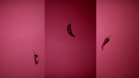 fresh spicy chili peppers tossed up flying hanging in the air and falling down