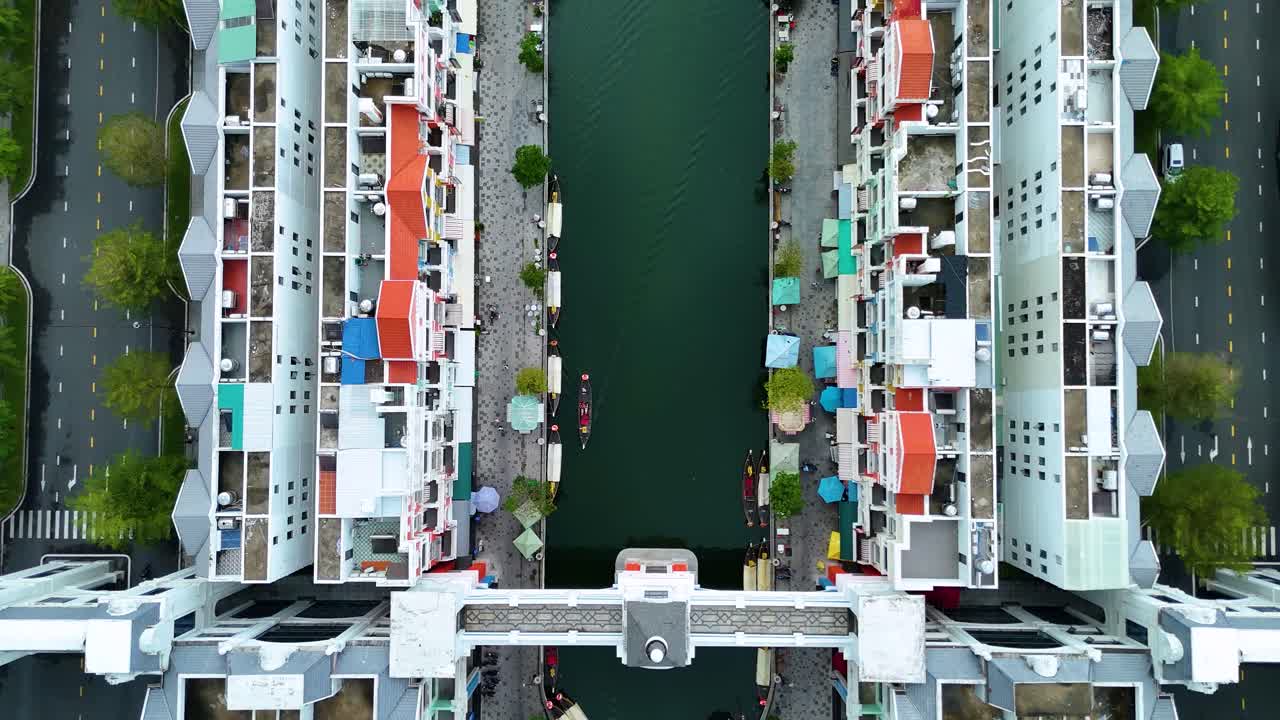 Aerial: Grand World water and hotels during the day, fake Italian city in Phu Quoc Island, Vietnam, top-down drone shot