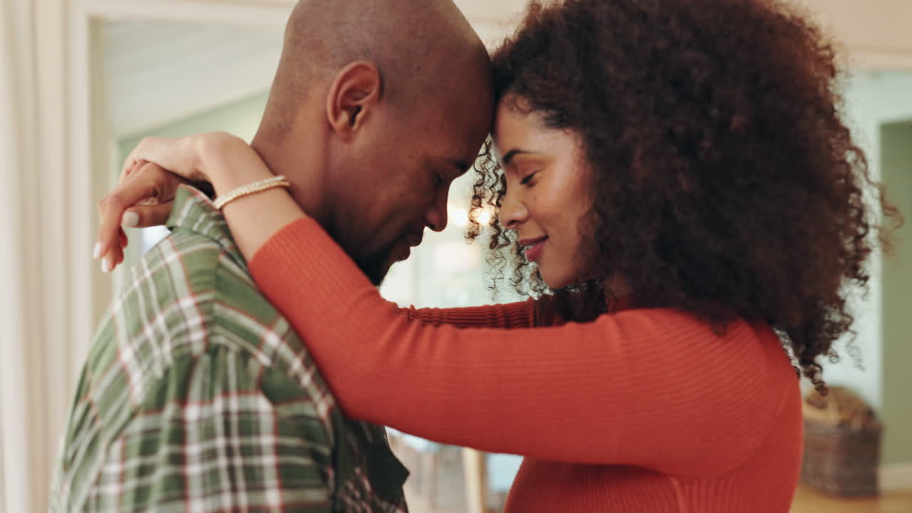 An Affectionate Couple Embracing at Home