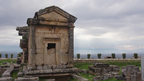 wide shot of tomb a18 and the cloudy sky in the ancient necropolis of hierapolis