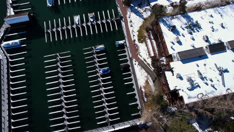 Aerial-View,-Marina-and-Lakefront-Buildings-in-Tahoe-City,-Lake-Tahoe-California-USA,-Revealing-Tilt-Up-Drone-Shot