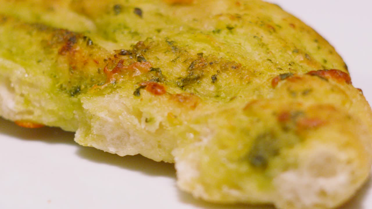 Slow Moving Shot Over Freshly Baked Mozzarella and Tomato Pesto Garlic Bread. Fresh Italian Side Dish Food