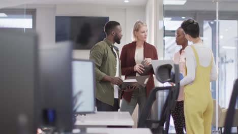 diverse group of male and female business colleagues working in office