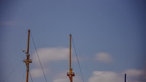 wooden ship masts moving due to waves of sea, time lapse view