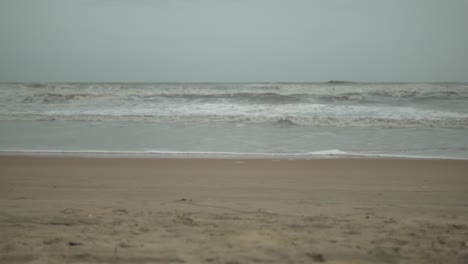 Static-shot-of-the-Carmona-Beach,-India-during-a-cloudy-moody-day