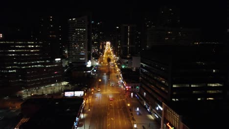 Night-drone-flight-over-famous-Yonge-street-in-Toronto-with-light-traffic