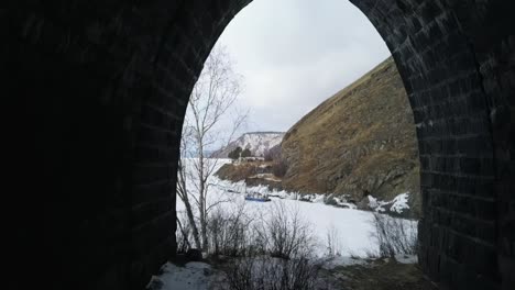 winter tunnel view over frozen river