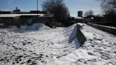 Snow-covered-skate-park-on-a-sunny-day,-Sheffield