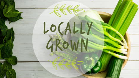 animation of locally grown text in green, over bowl of fresh green vegetables on white boards