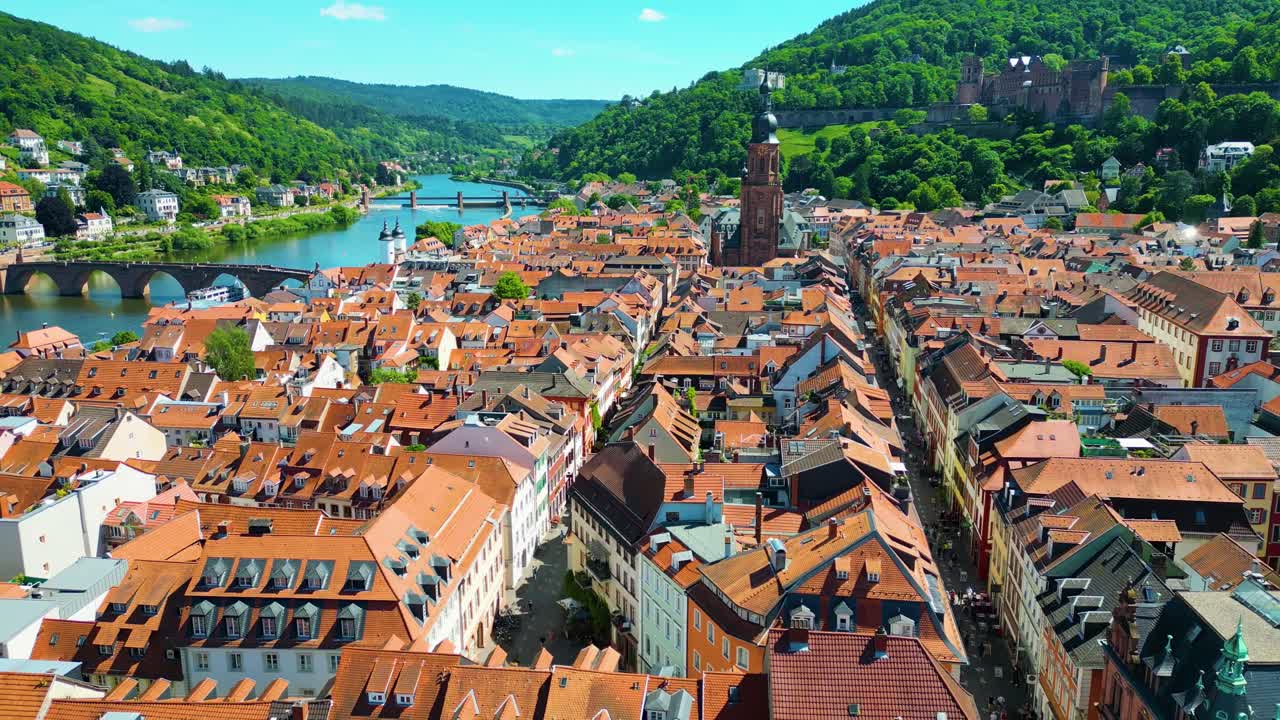 4K Aerial Drone Video of Historic Homes, Shops, and Churches with the Castle on Königstuhl Hill in the background in Heidelberg, Germany