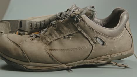 dolly of pair of worn and torn hiking shoes