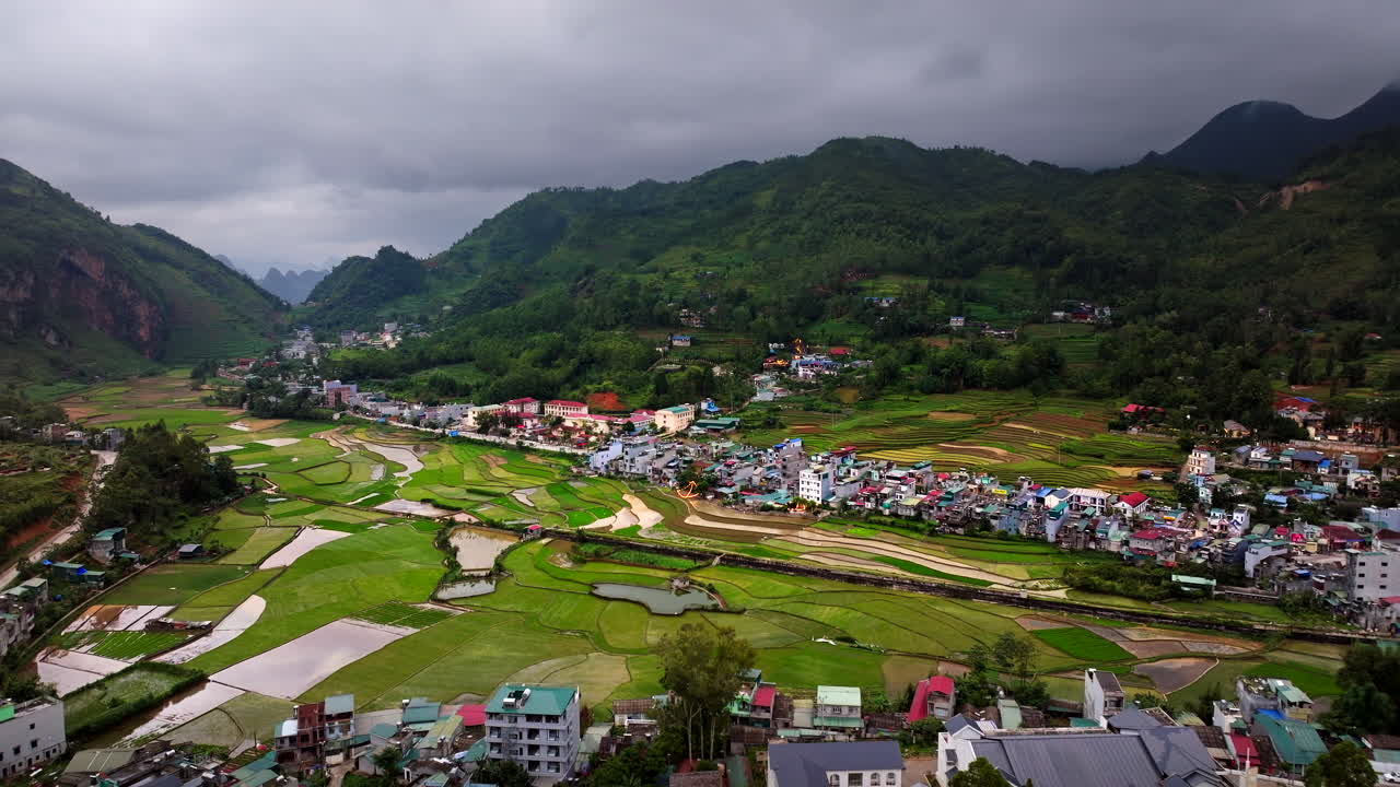 Aerial View of Rice Terraces and Village in the Mountains of Vietnam