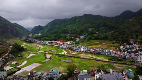 aerial view of rice terraces and village in the mountains of vietnam