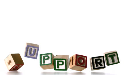 support spelled out in letter blocks falling over